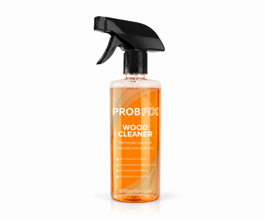 A 500ml spray bottle of PROB FIX Wood Cleaner, featuring a black trigger spray cap and a clear bottle showing the orange liquid inside, set against a plain white background.