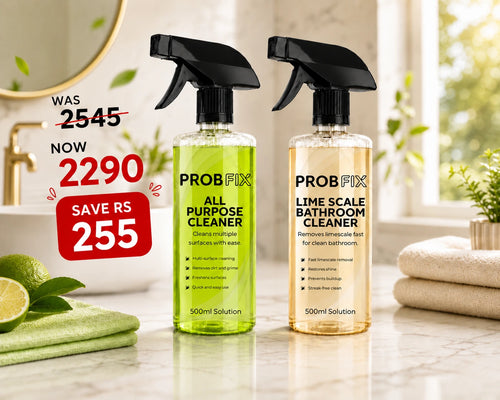 Two Probfix Bathroom Deep Clean spray bottles shown in a promotional bundle: one yellow-green cleaner and one red cleaner, with a folded cloth and scrub brush on a light surface. Large text advertises the bundle and price savings.